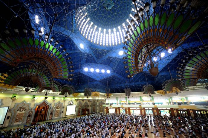 Indonesian Muslims attend Friday prayers